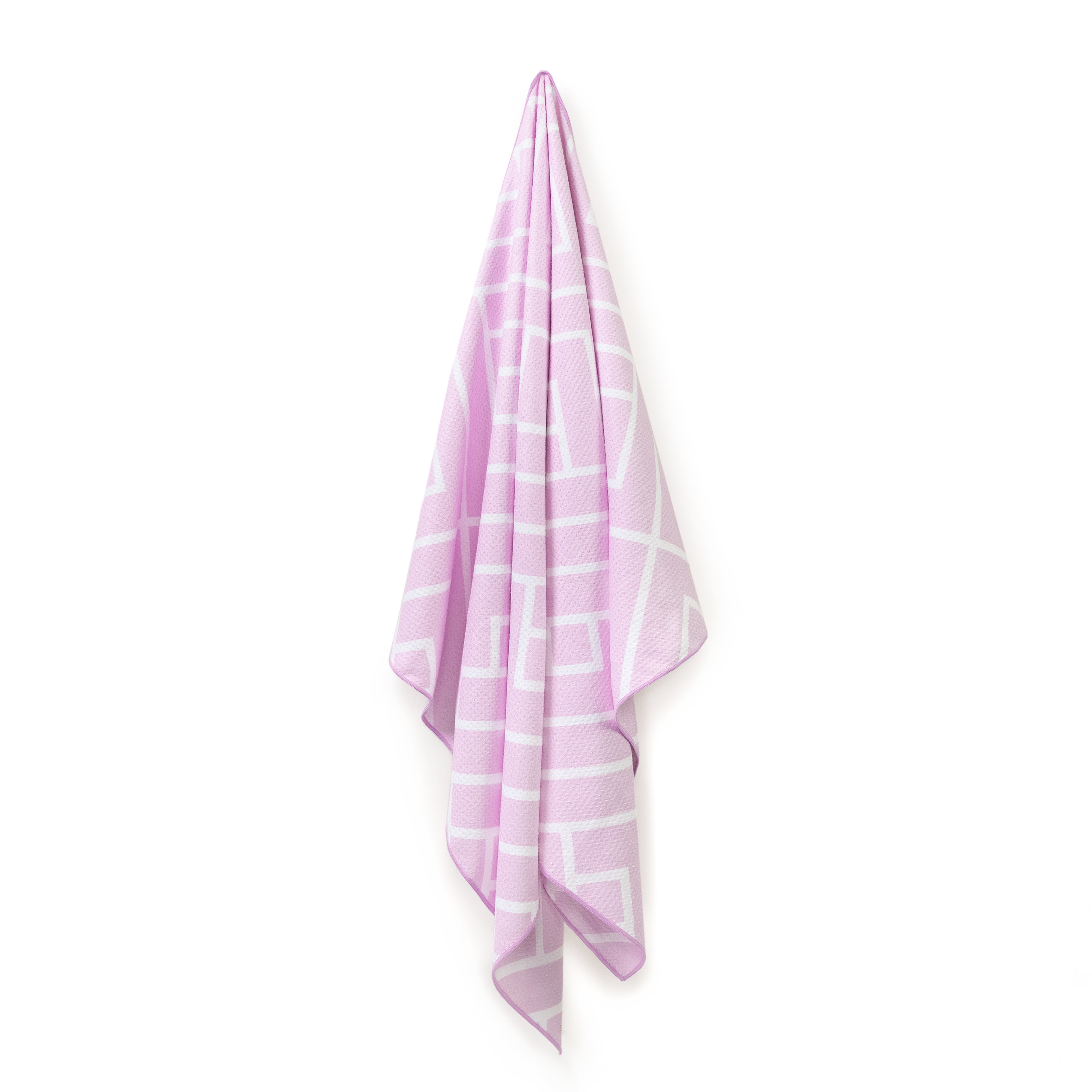 Pink Newlyfe waffle-weave bath towel hanging